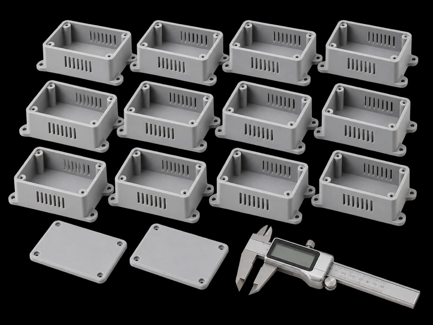 Identical 3D printed enclosure housings arranged in production rows with inspection calipers
