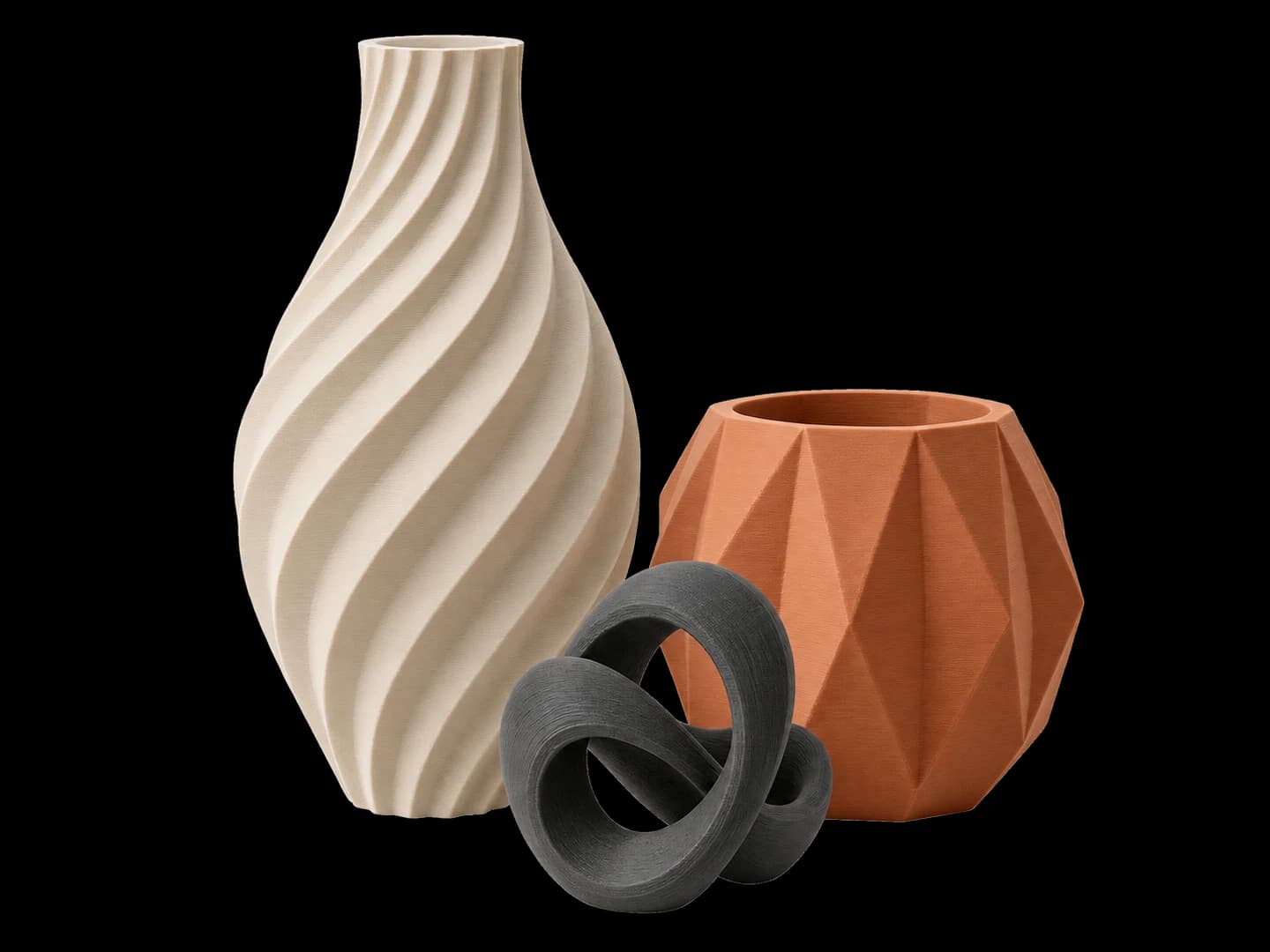 3D printed ivory spiral vase, terracotta planter and charcoal sculptural desk piece