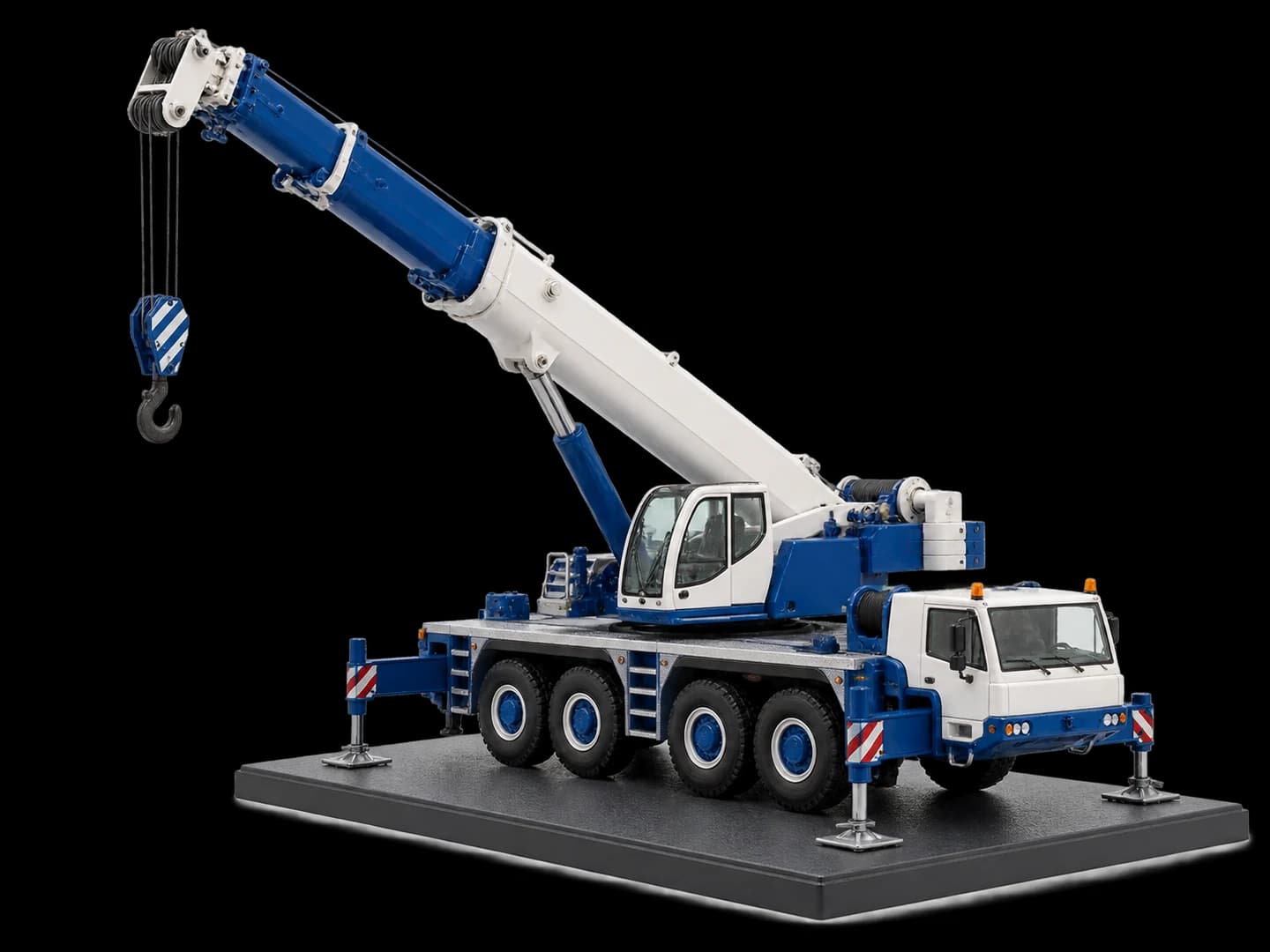 Blue and white miniature mobile crane with a telescopic boom on a display base